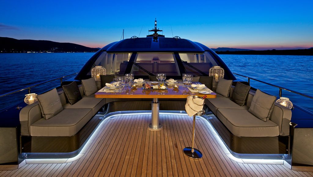 on deck of super yacht at night